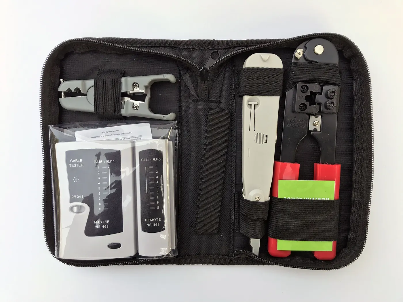 Network toolkit with cable tester, crimper, stripper and punch-down tool