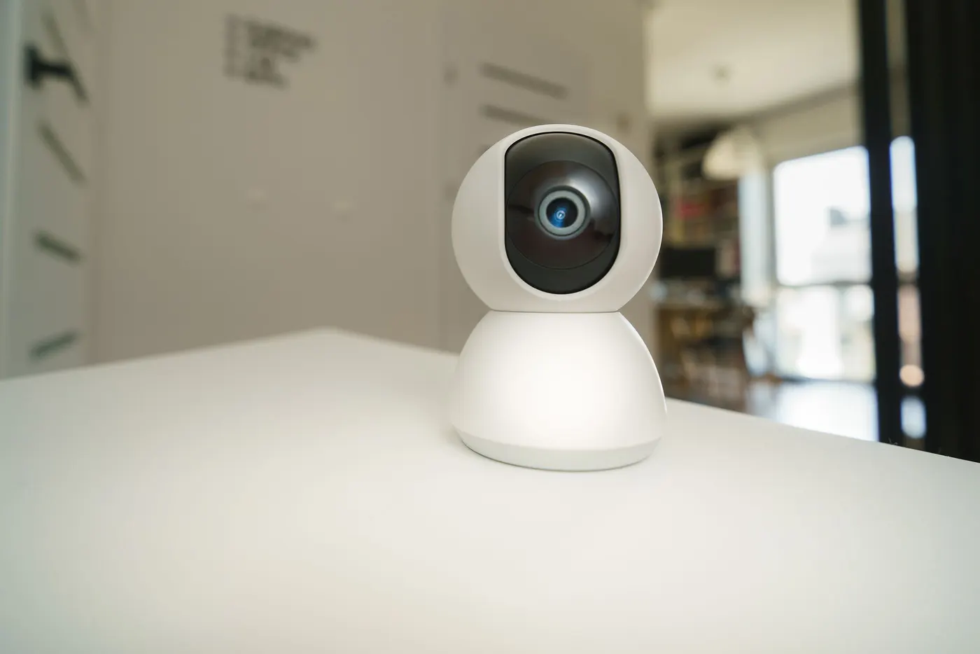 Indoor pan-tilt home security camera on a table