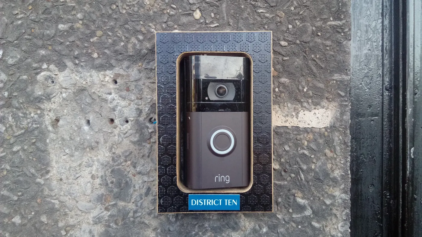 Video doorbell mounted beside a front door