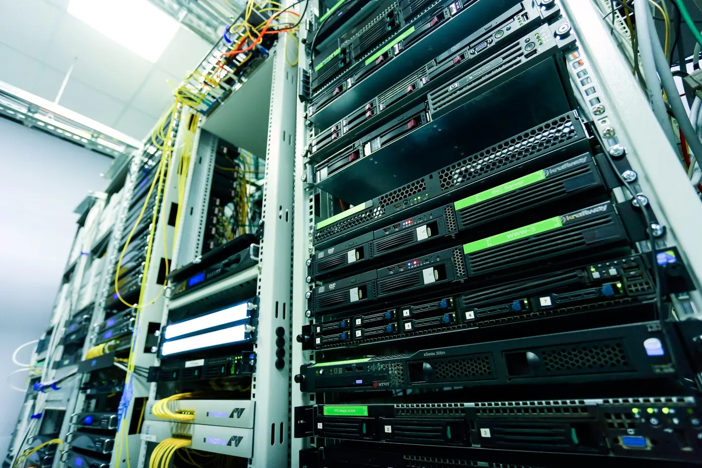 Front of a server rack with rack-mounted servers and network cabling
