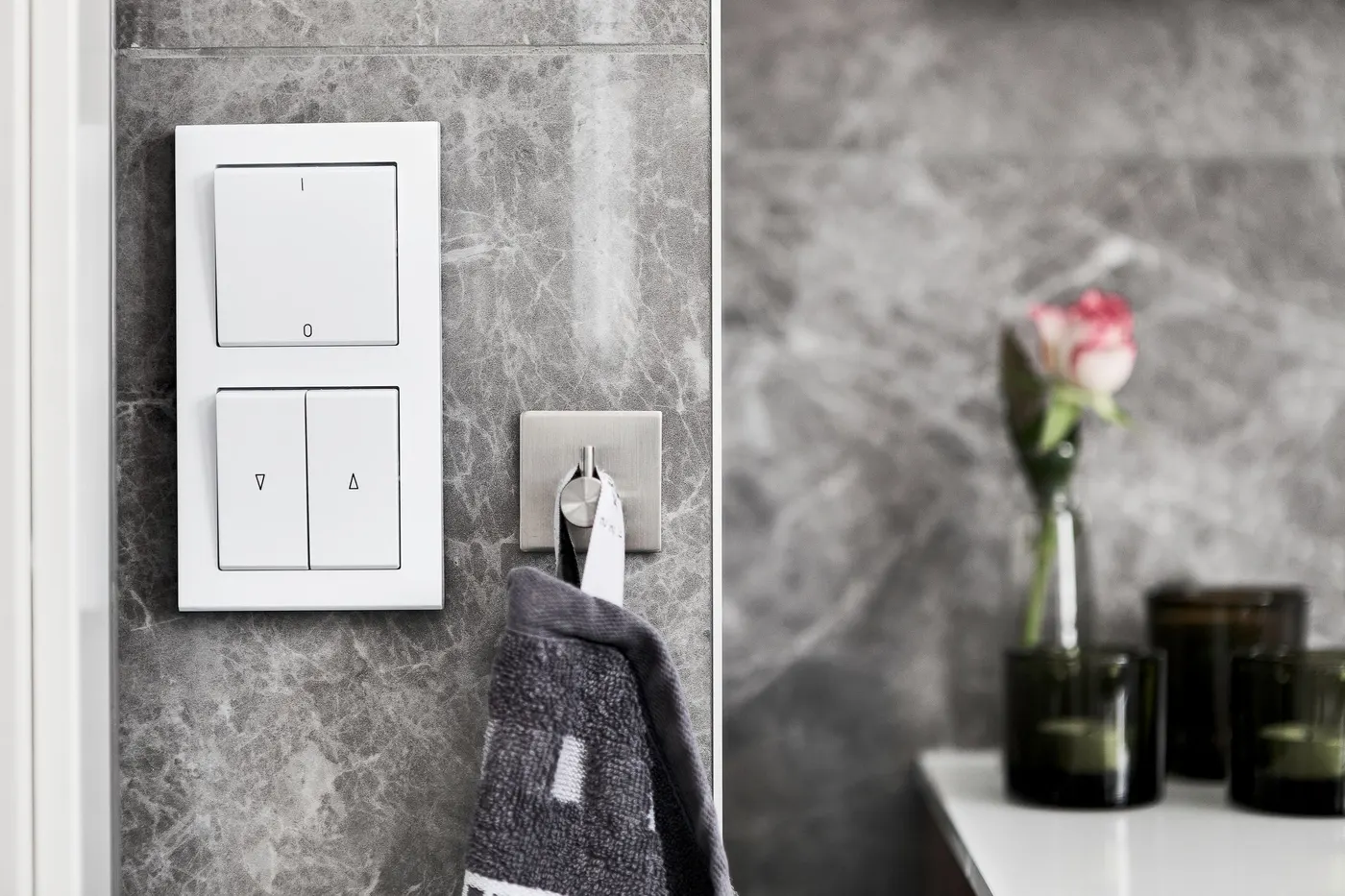 Smart light switch panel on a marble wall