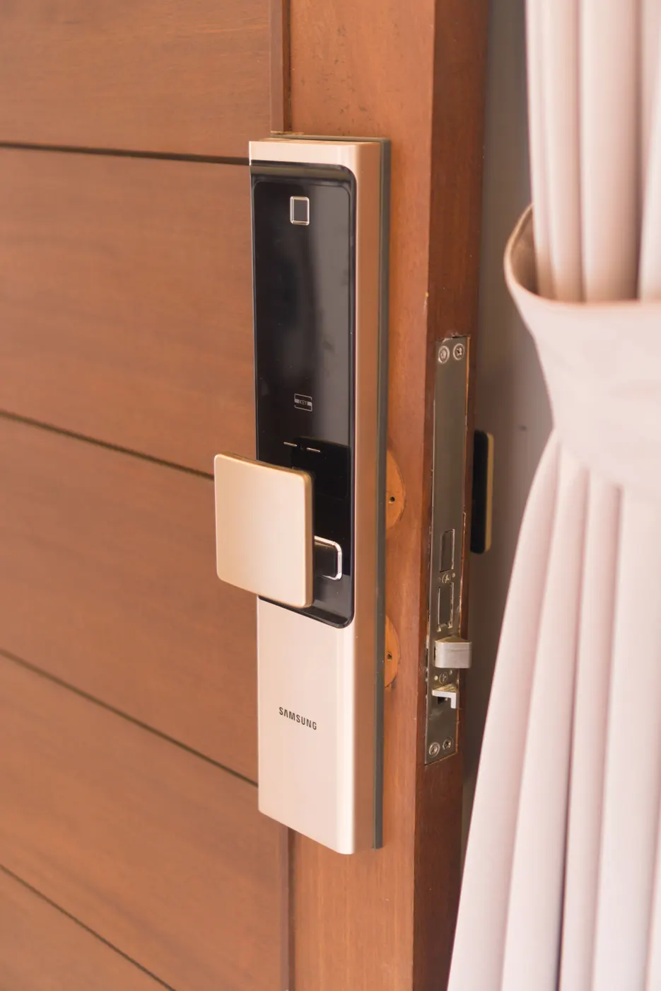 Digital smart lock with keypad on a wooden door
