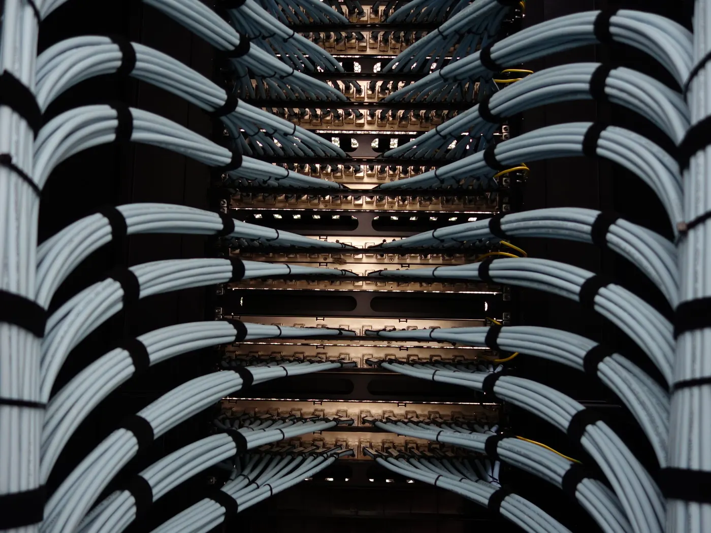 Neatly bundled and dressed network cables in a server rack