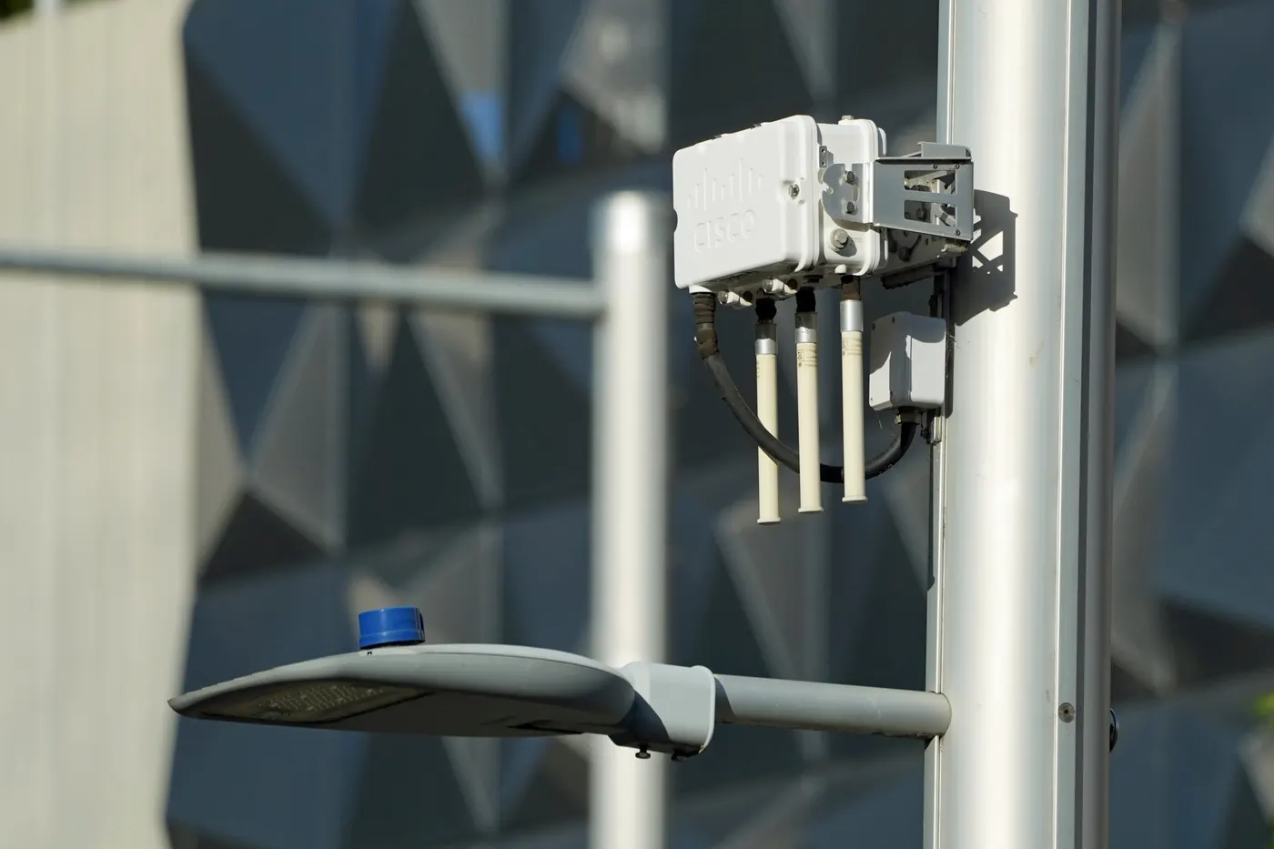 Outdoor Wi-Fi access point mounted on a street light pole