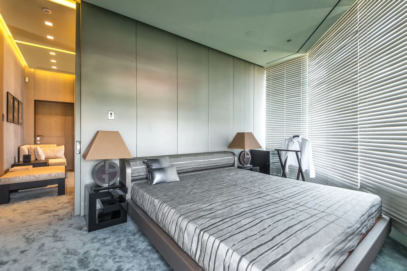 Modern bedroom with full-height window blinds